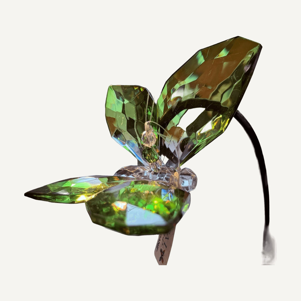 Green faceted crystal butterfly hanging by a clear cord