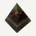 Green layered resin pyramid with colorful tumbled stones near the peak