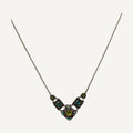 Lime and teal crystal mosaic necklace on a wooden bust