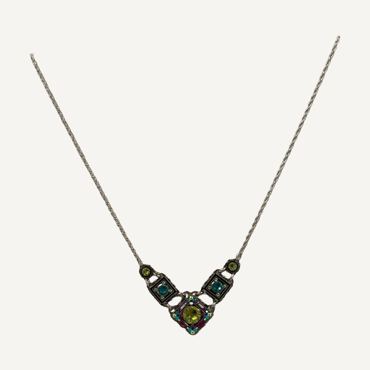 Lime and teal crystal mosaic necklace on a wooden bust
