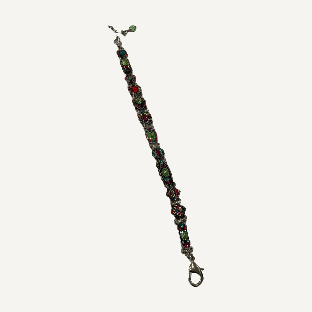 Lime green and fuchsia crystal mosaic link bracelet lying flat