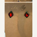 Diamond-shaped stud earrings with orange-red crystals on a FireFly card