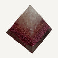 Pink resin mini pyramid with pale pink stone chips over magenta metallic flakes