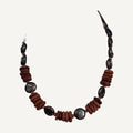 Purple coin pearl and copper goldstone rondelle necklace on a cream bust